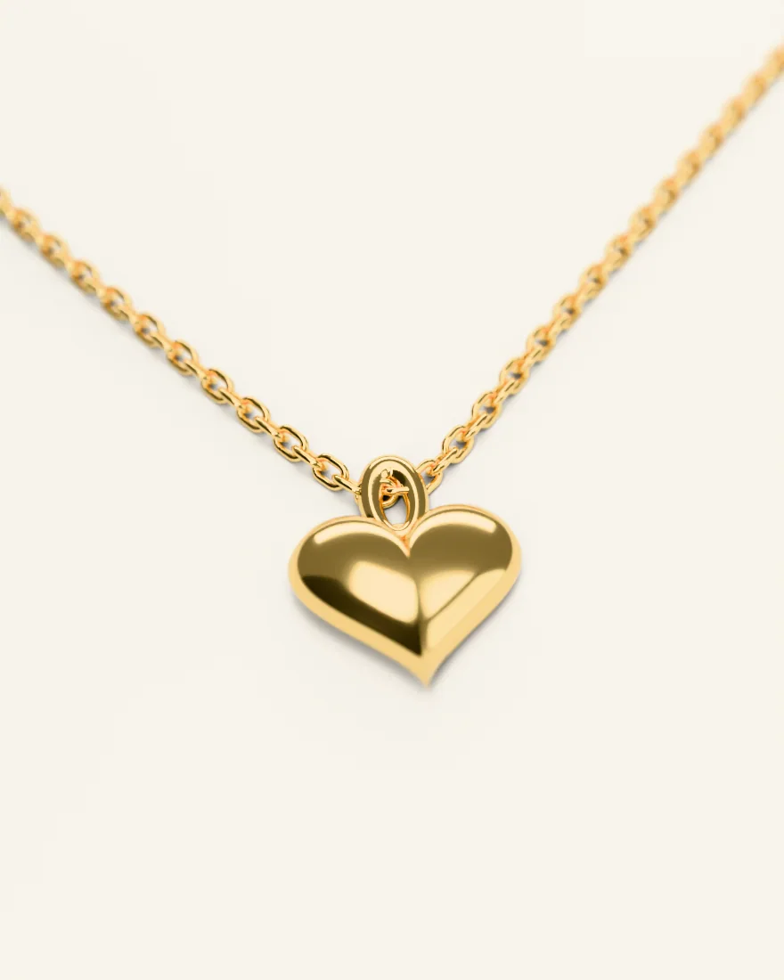 Polished gold heart pendant on a fine chain
