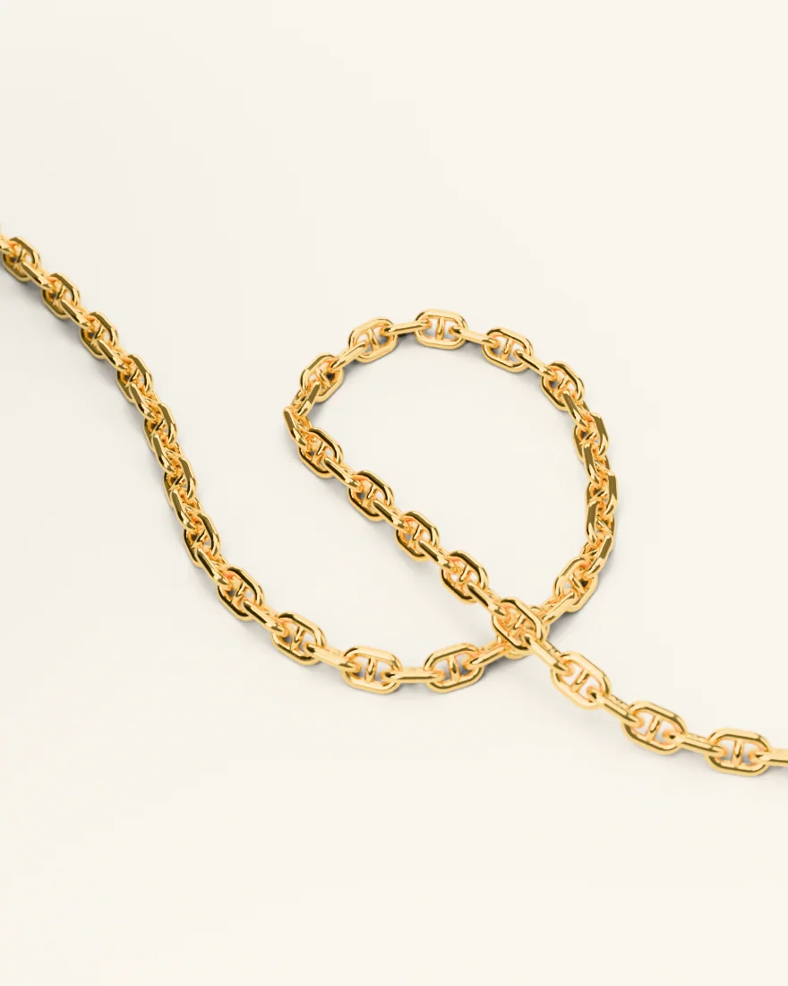 Gold mariner chain curled into a loop