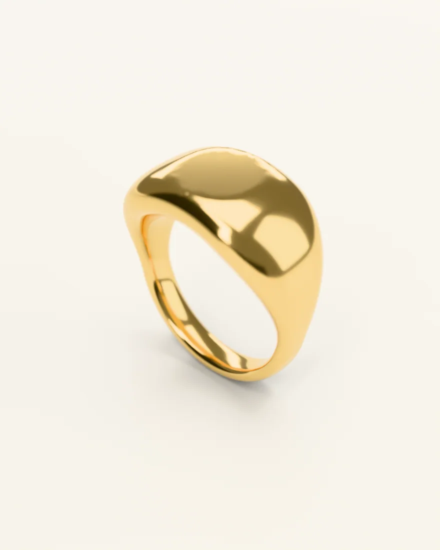 Gold signet ring with a plain oval face, standing upright